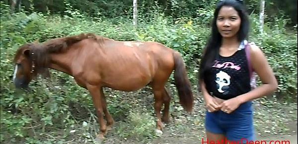  peeing next to horse in jungle